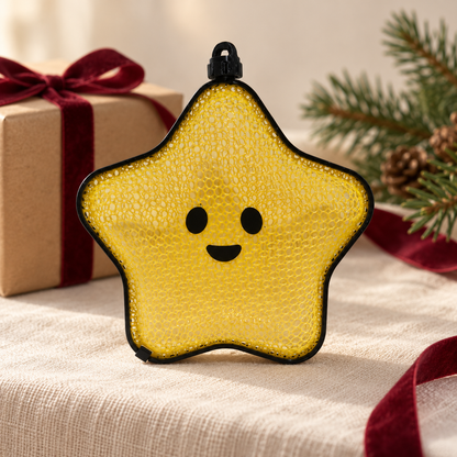 Styled mockup of the closed yellow mesh star on cream linen beside festive gift wrapping; surrounding props are not included